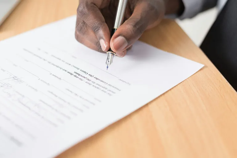 Signing legal paperwork to begin court order enforcement in a Texas family court