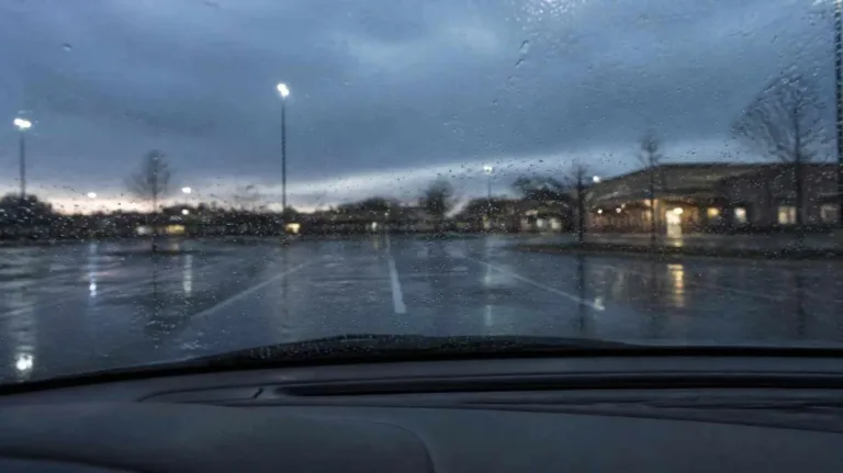Parent waiting in a car after a denied custody exchange, a common trigger for custody order enforcement in Texas
